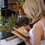 Cannabis office employee surrounded by plants